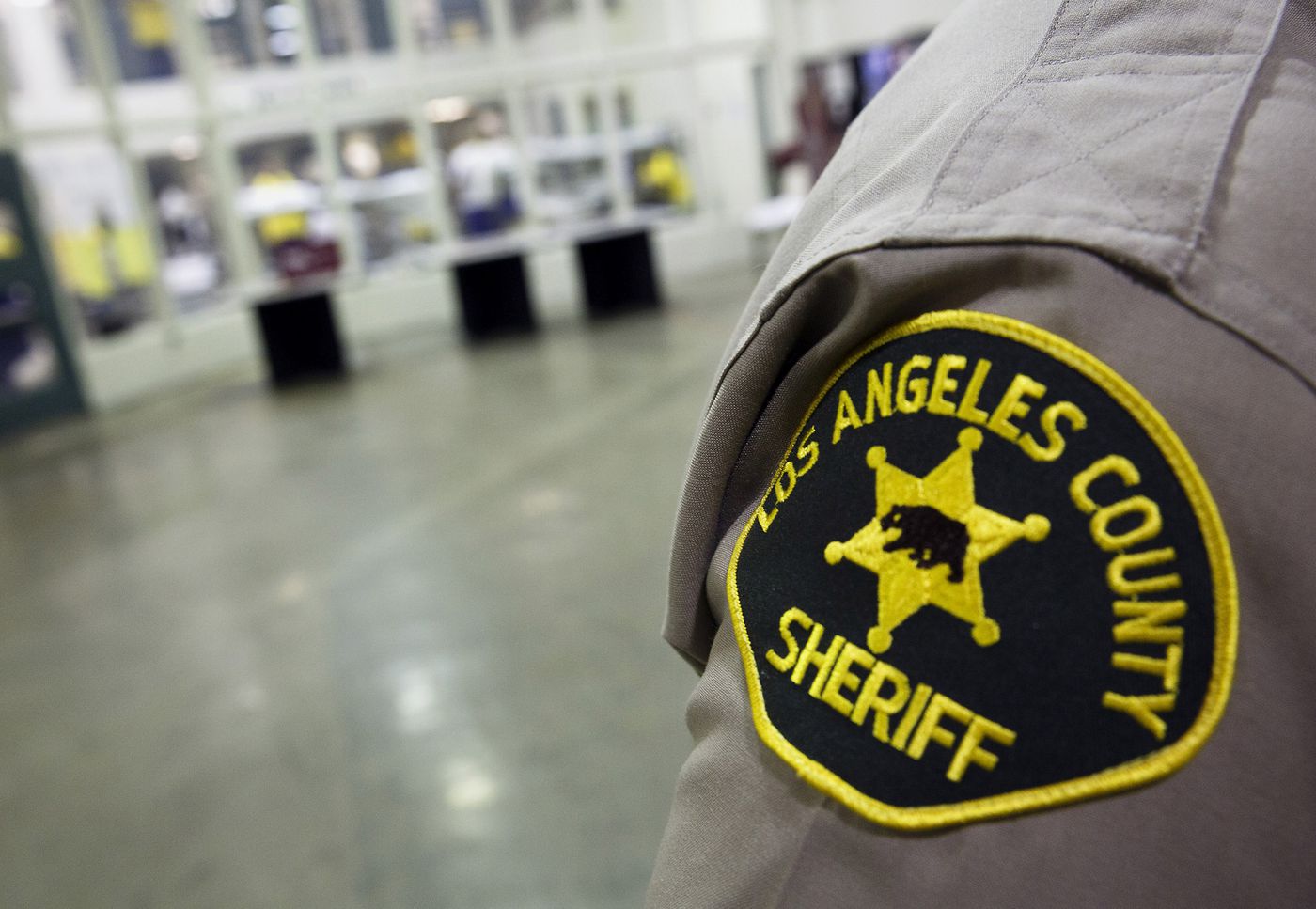A Los Angels County Sheriff patch is seen on an officer